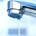 Leaking faucet dripping water illustrating plumbing repair and maintenance.
